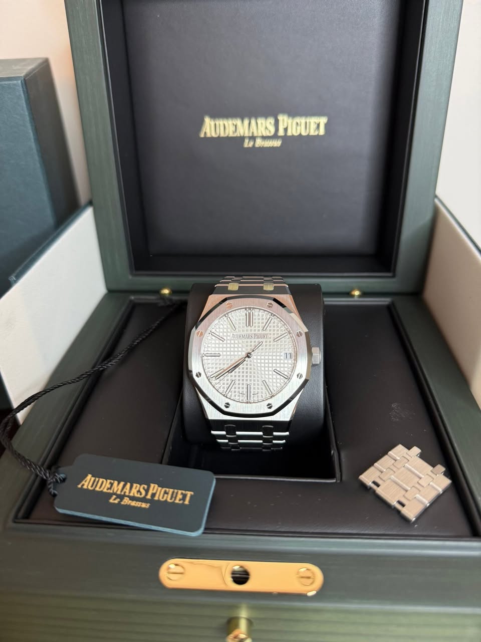 May be an image of wrist watch and text