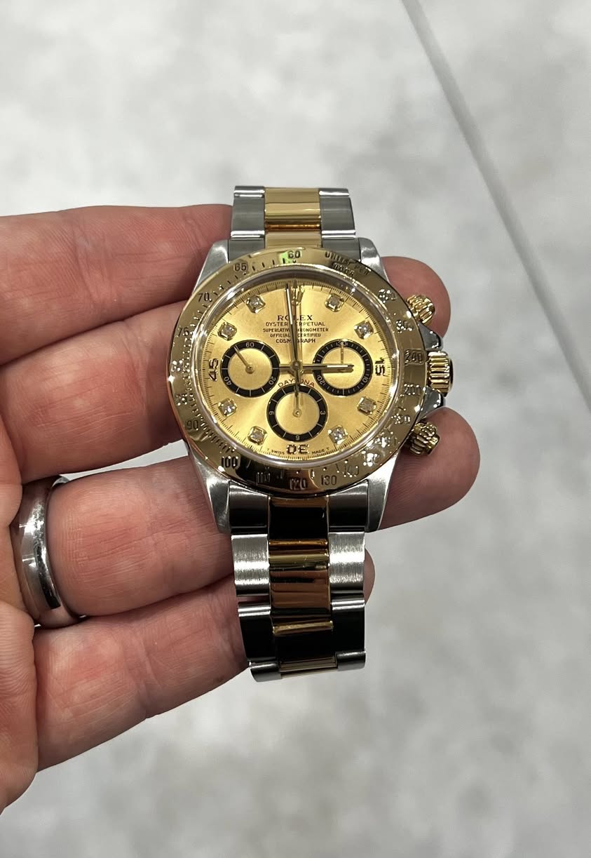 May be an image of wrist watch and text
