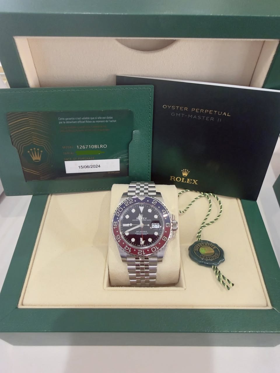 May be an image of wrist watch and text that says '126710BLRO OBL RO 12671 15/06/2024 OLEX A A C S x 22 ၁ b '