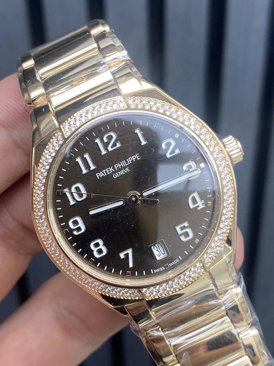 May be an image of wrist watch and text that says ' PHILIPPE PATEKPHILIPPE IPPE PATEK GENEVE ম 10 ب 9 cO 1 5 30 MADE SWISS'
