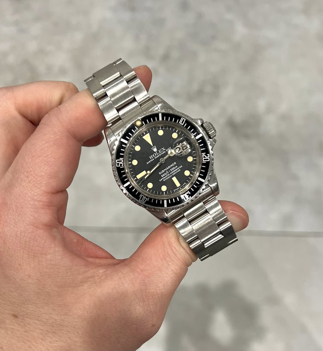 May be an image of wrist watch and text