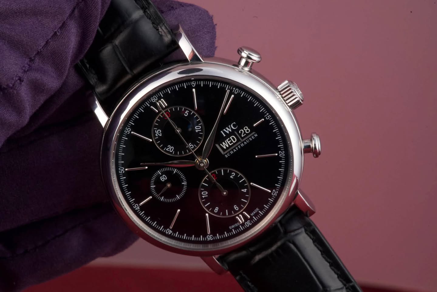 May be an image of wrist watch and text that says 'V UIIII IWC 28 WED 6'