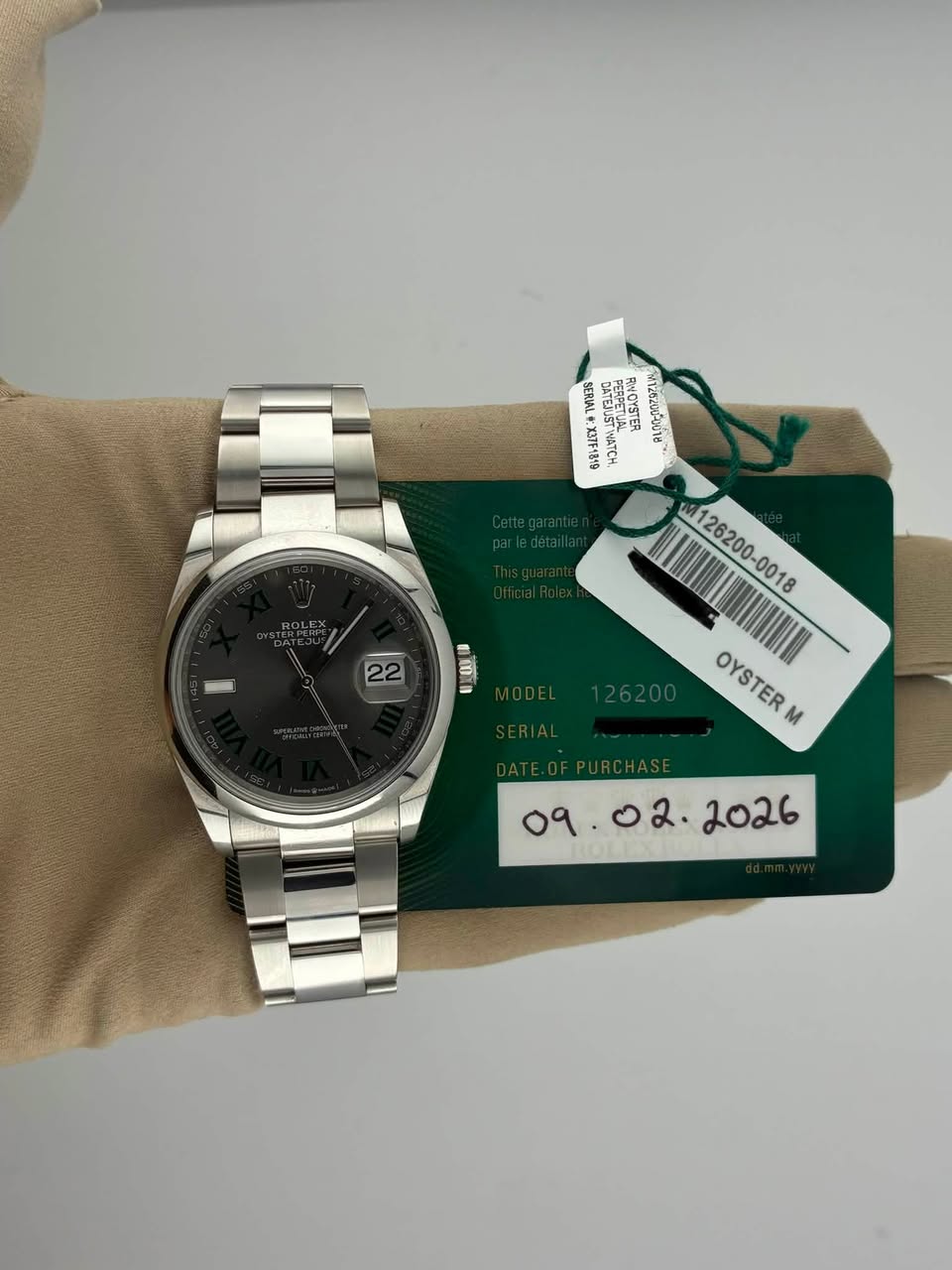 May be an image of wrist watch and text
