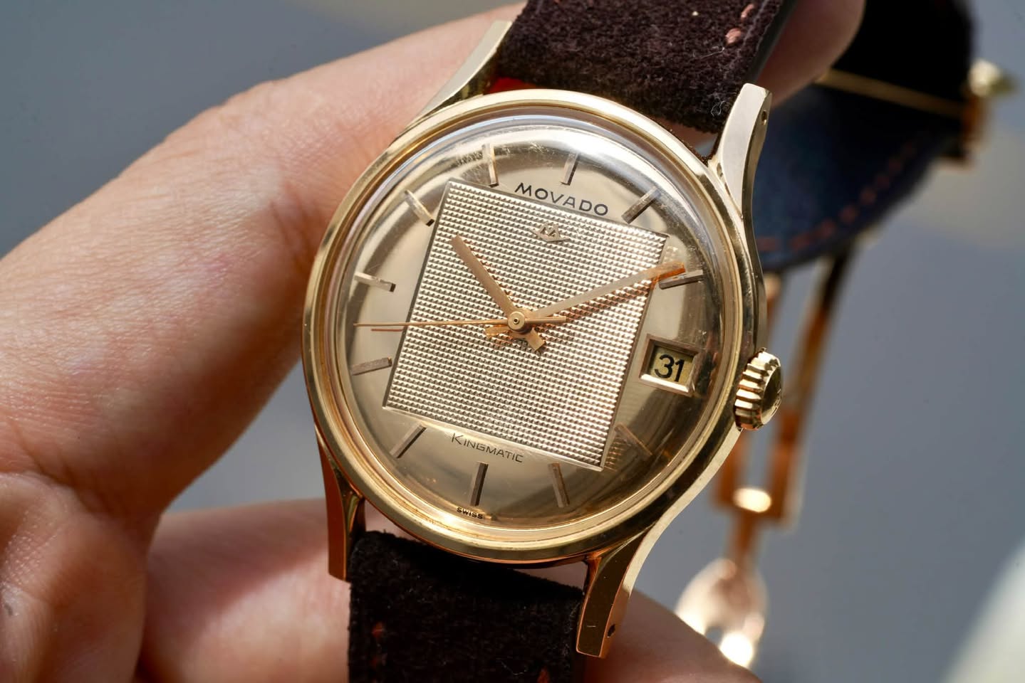 May be an image of wrist watch and text that says 'MOVADO DO 31 ANAN KINGMATIC KINGMATIC IC WIGs'