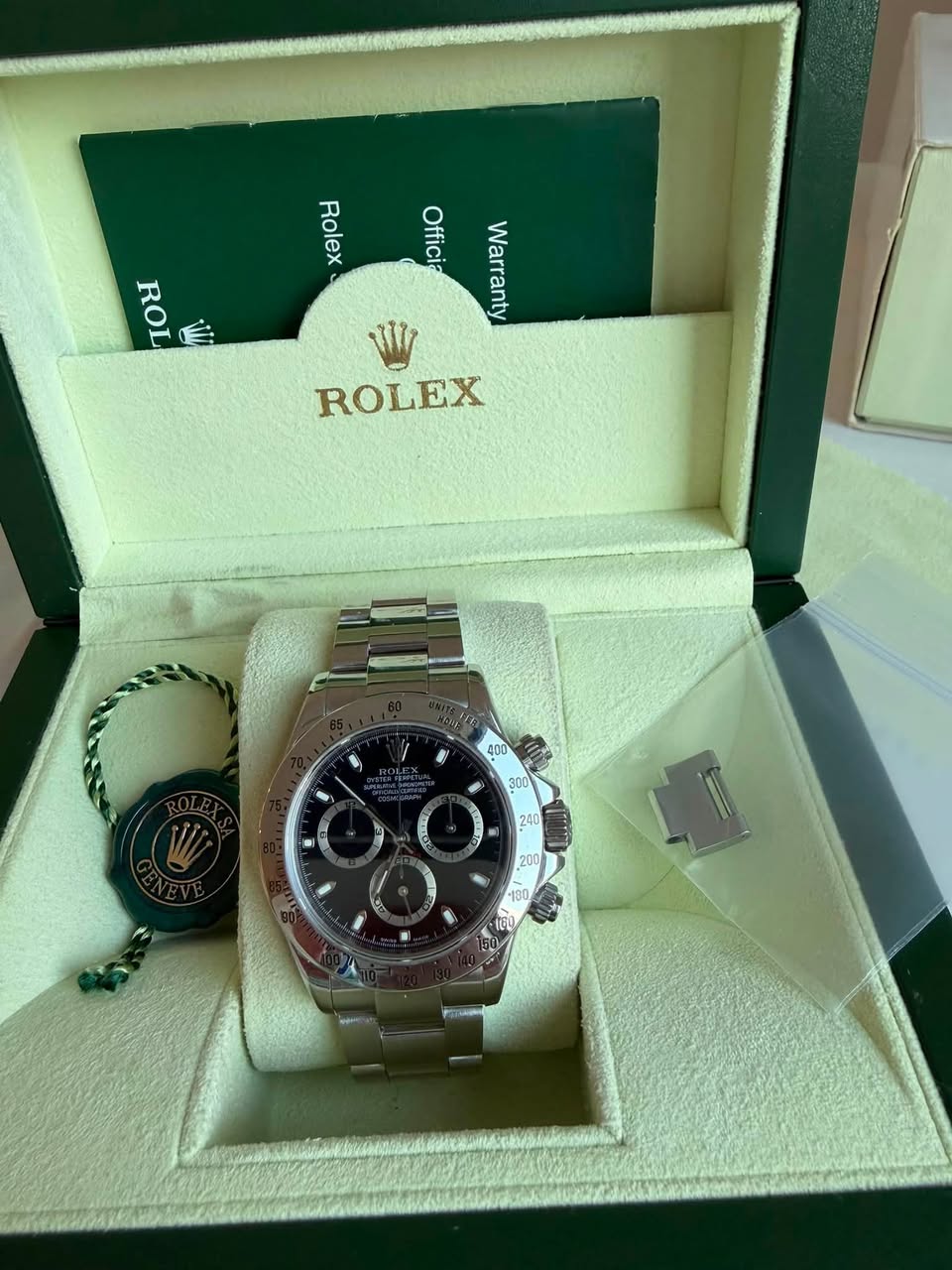 May be an image of wrist watch and text that says 'Rolex Rolex ROL Offici Officia Warranty W ROLEX '
