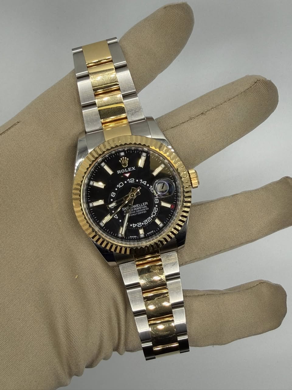 May be an image of wrist watch and text