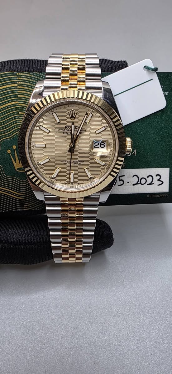 May be an image of wrist watch and text