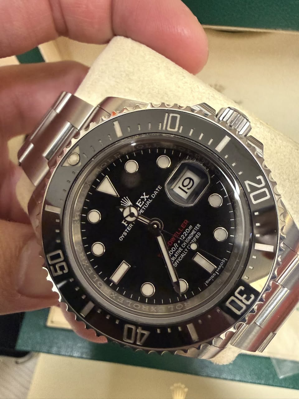 May be an image of wrist watch and text