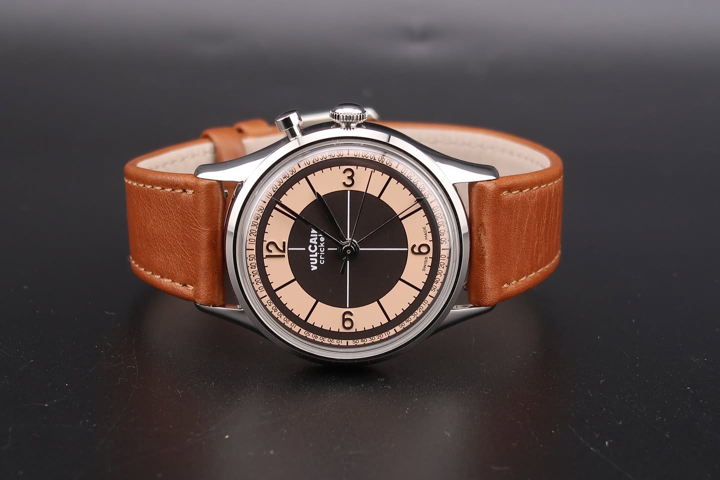 May be an image of leather, wrist watch and text