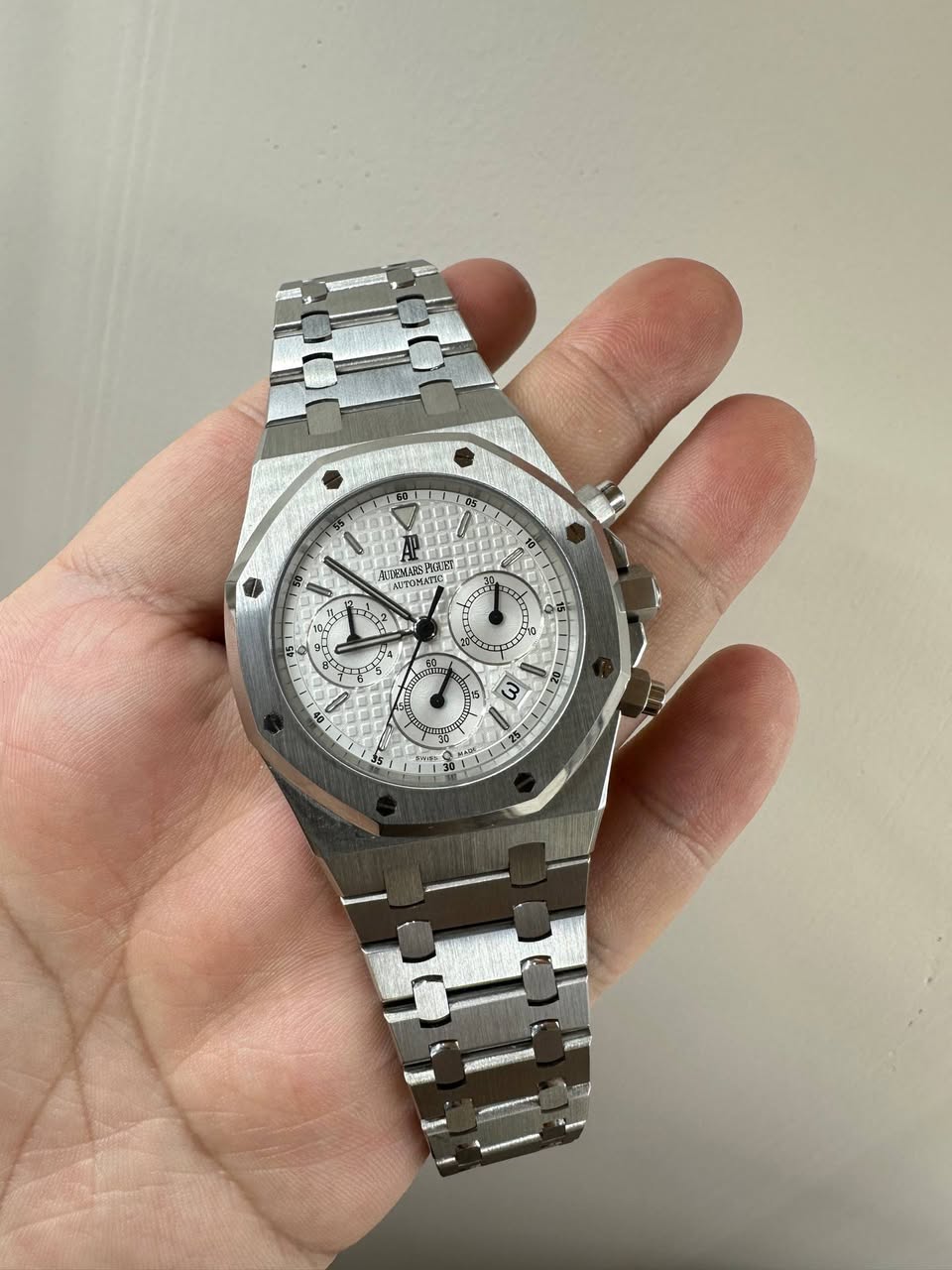 May be an image of wrist watch and text