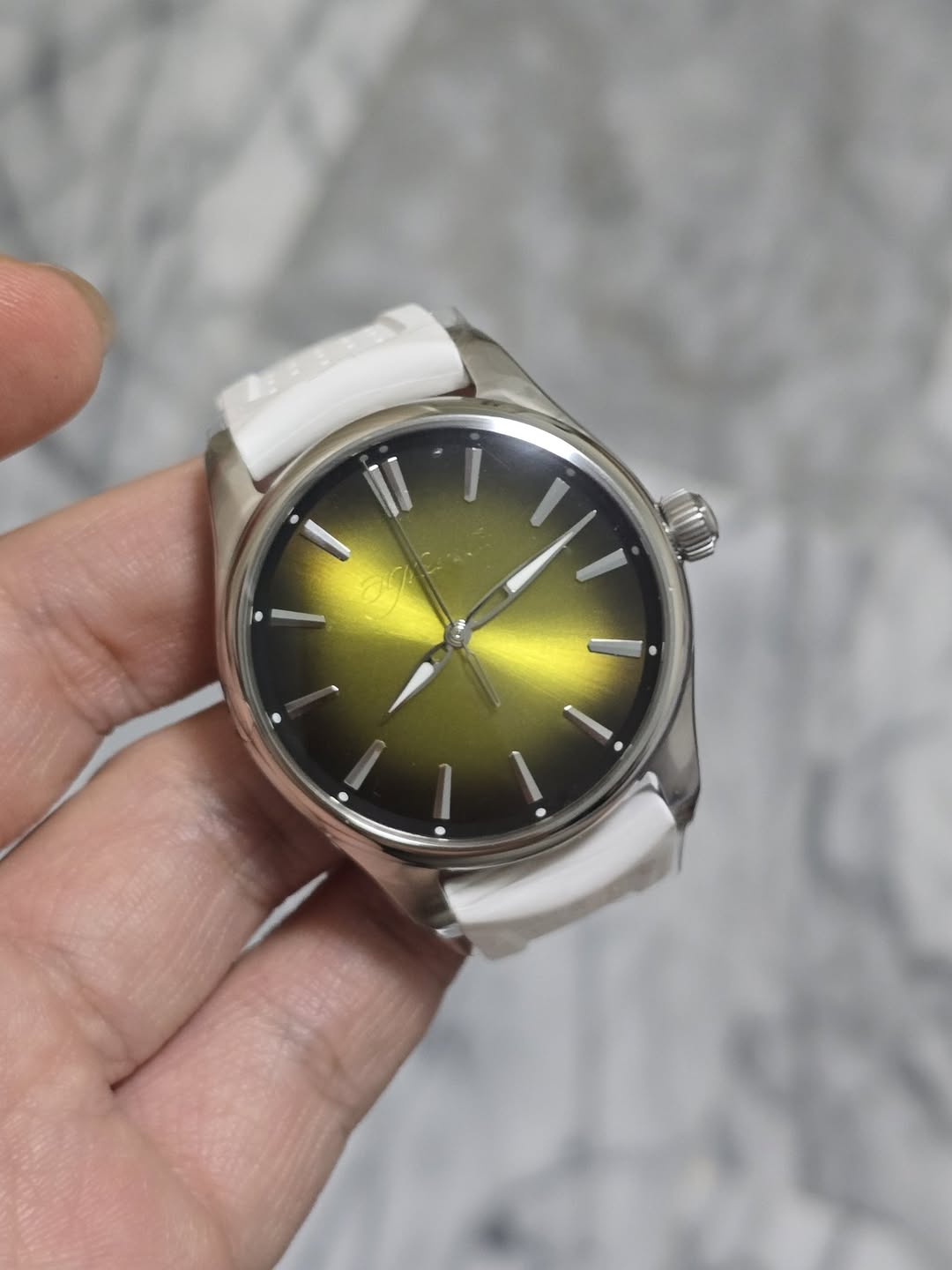 May be an image of wrist watch and text