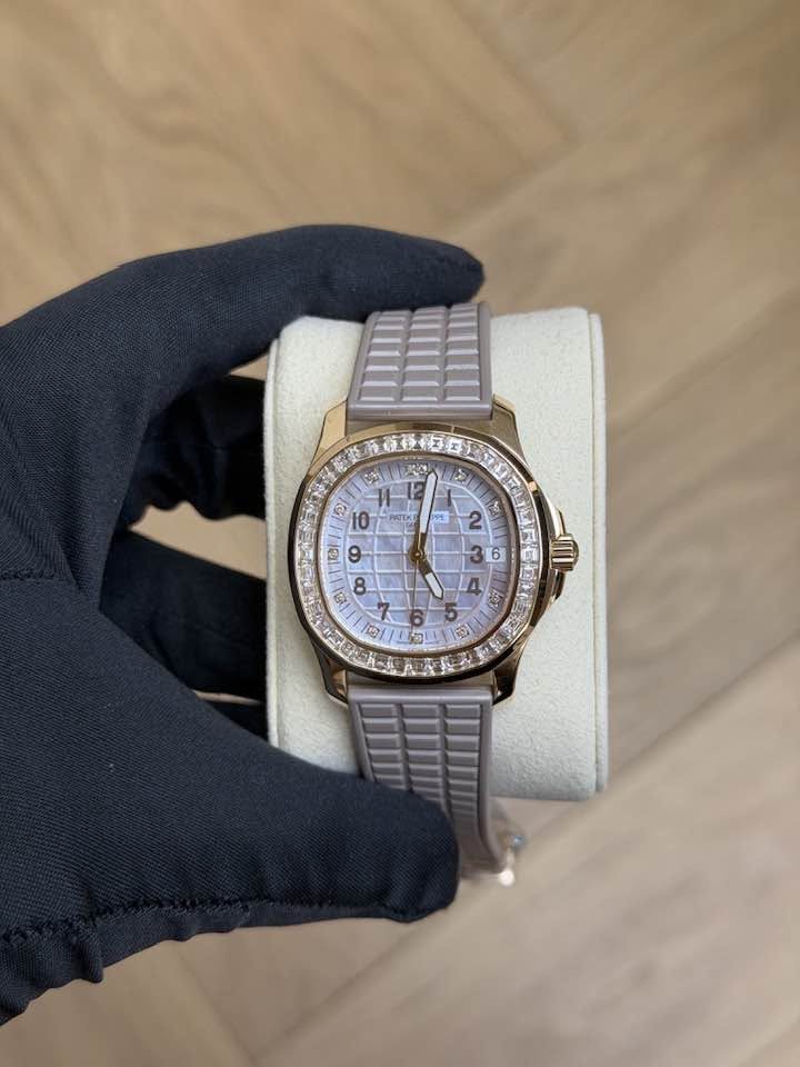 May be an image of wrist watch and text