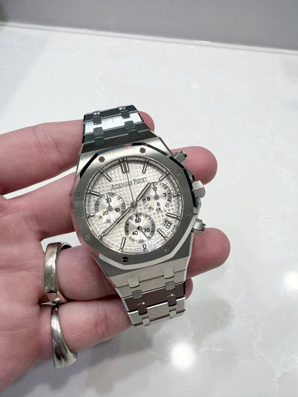 May be an image of wrist watch and text