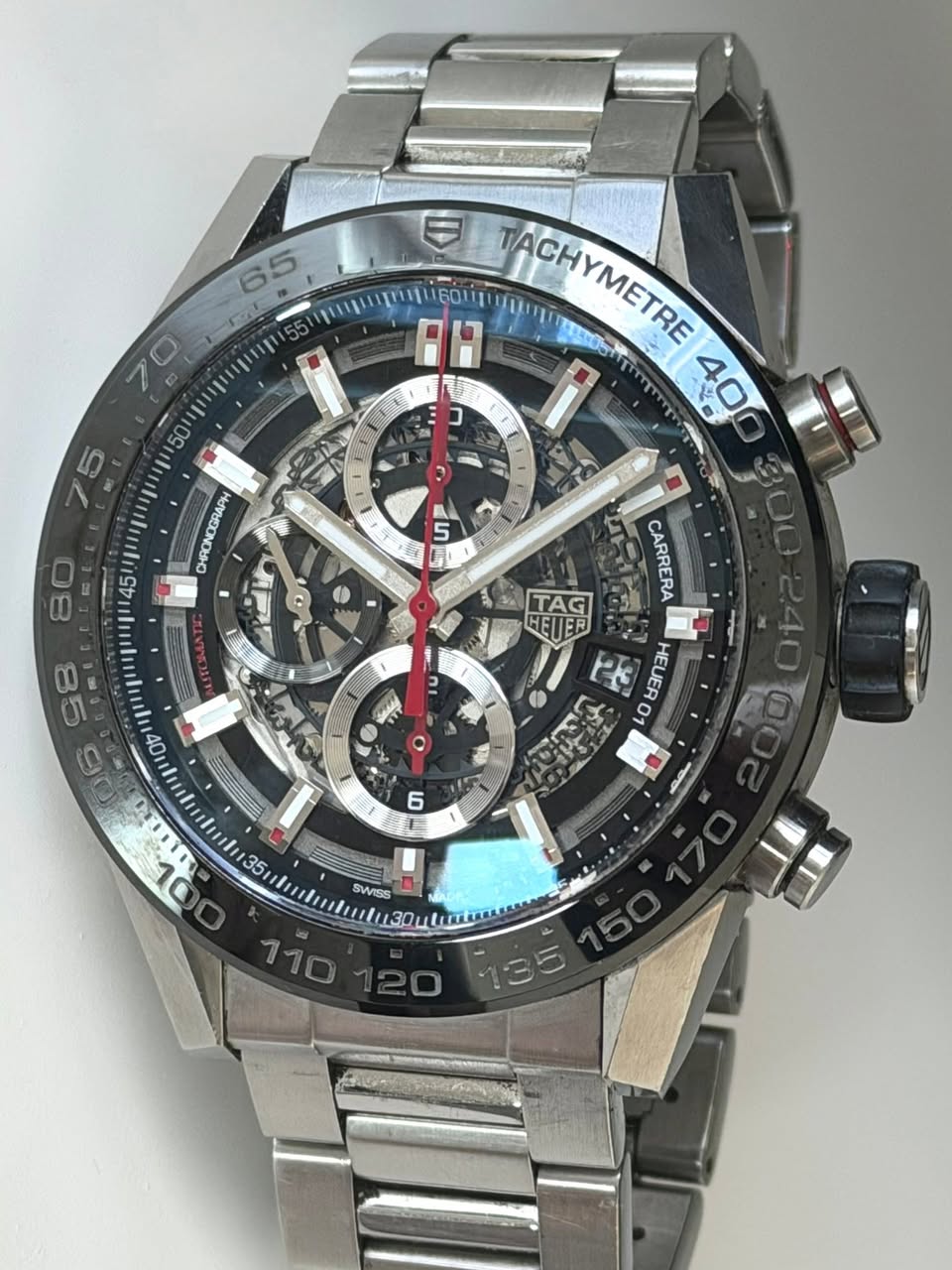May be an image of wrist watch and text