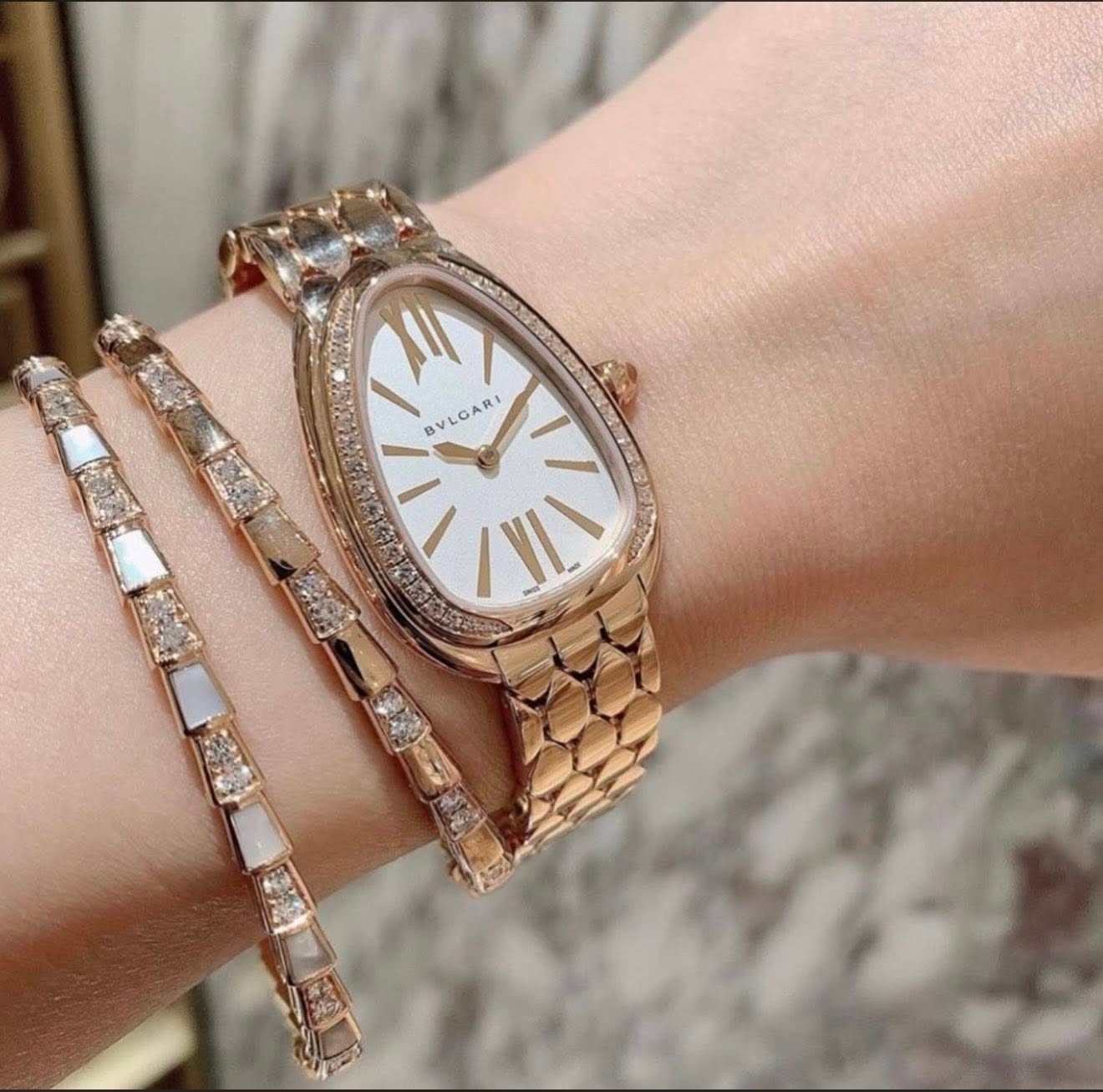 May be an image of wrist watch and jewelry