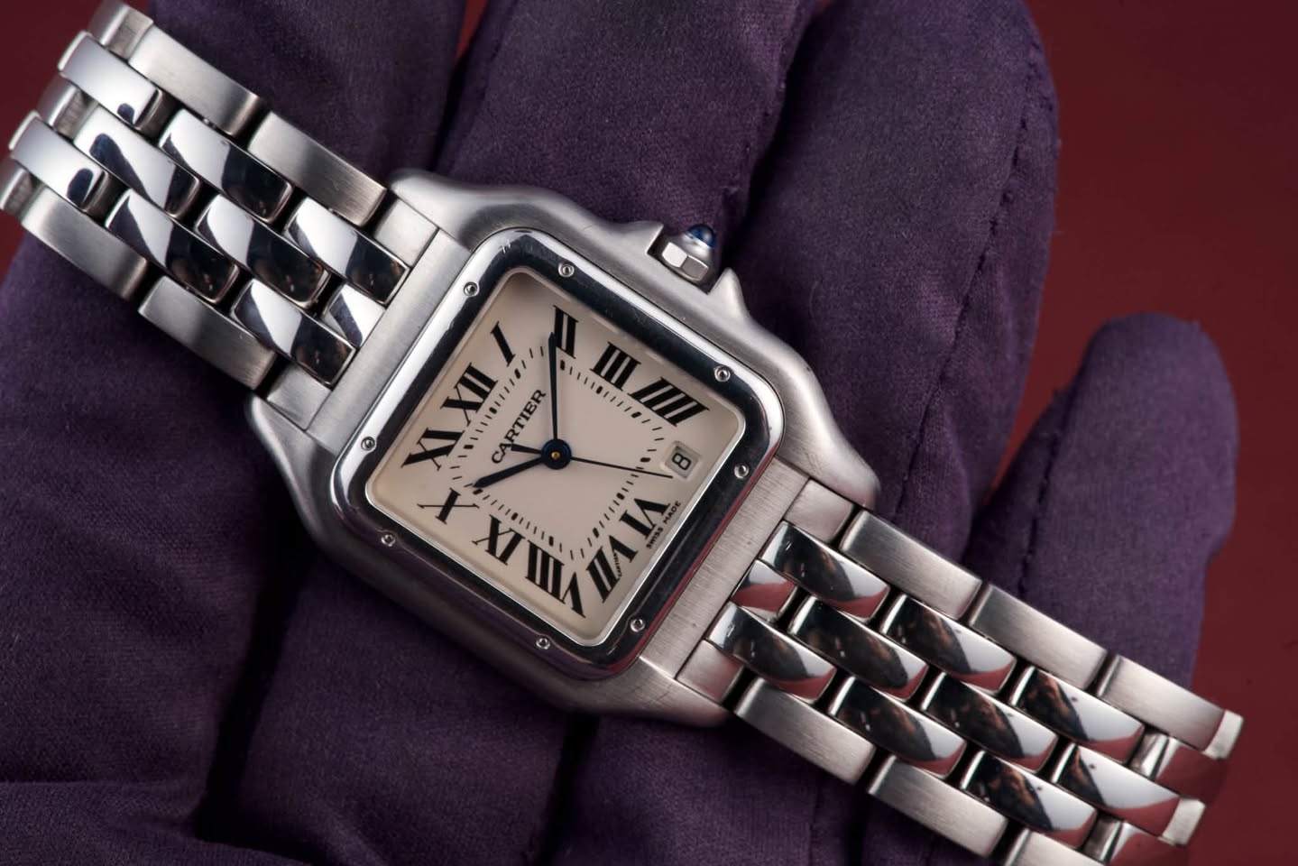 May be an image of wrist watch and text