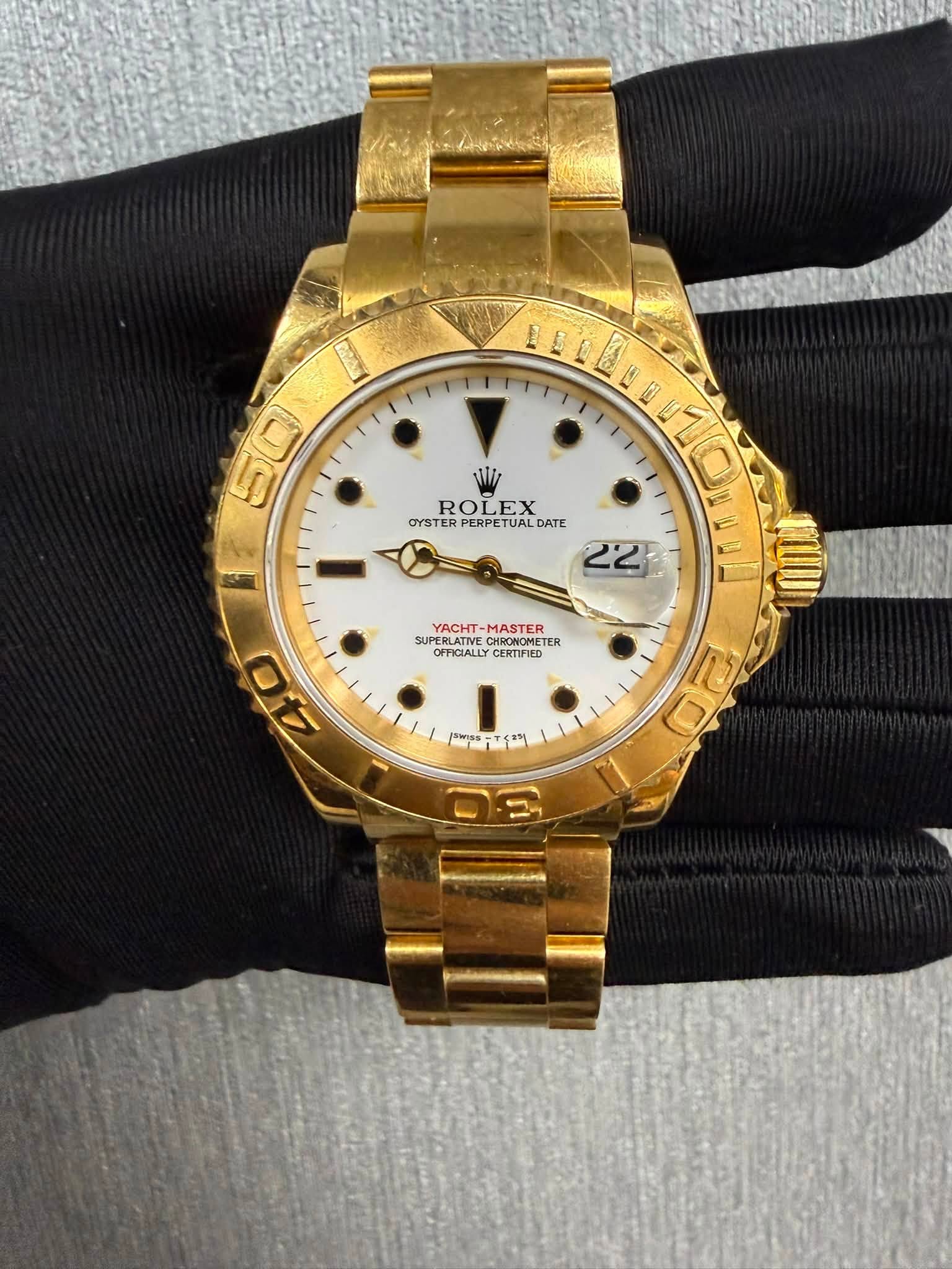 May be an image of wrist watch and text