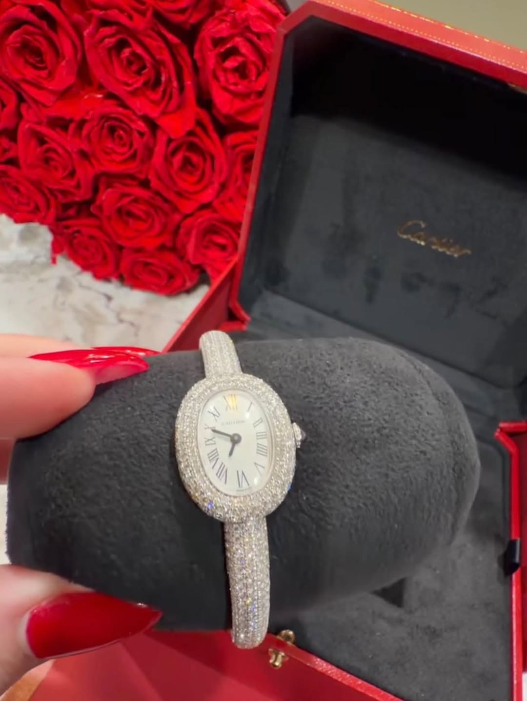 May be an image of wrist watch, ring and text