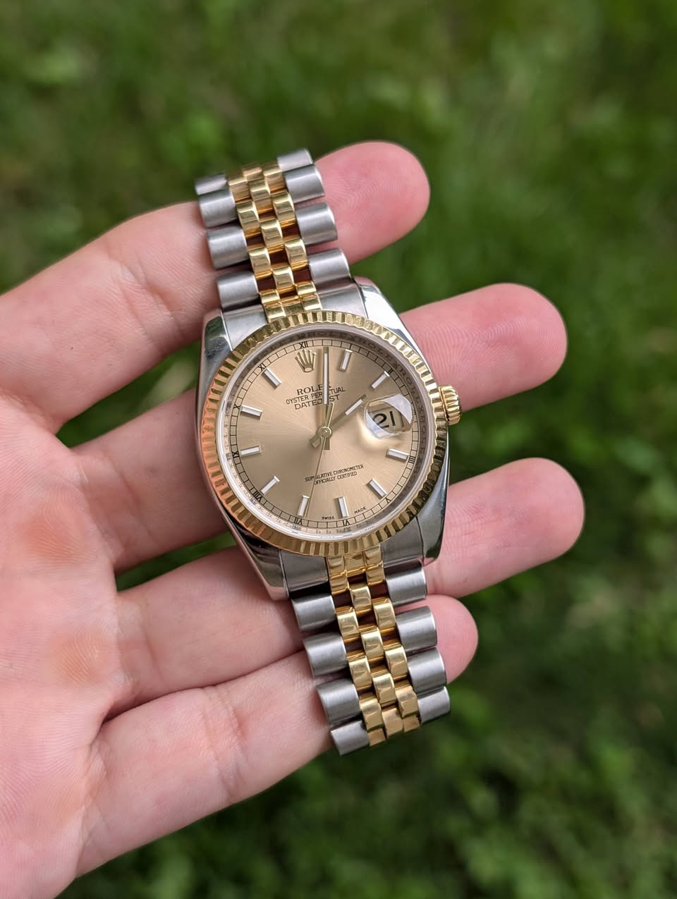 May be an image of wrist watch and text