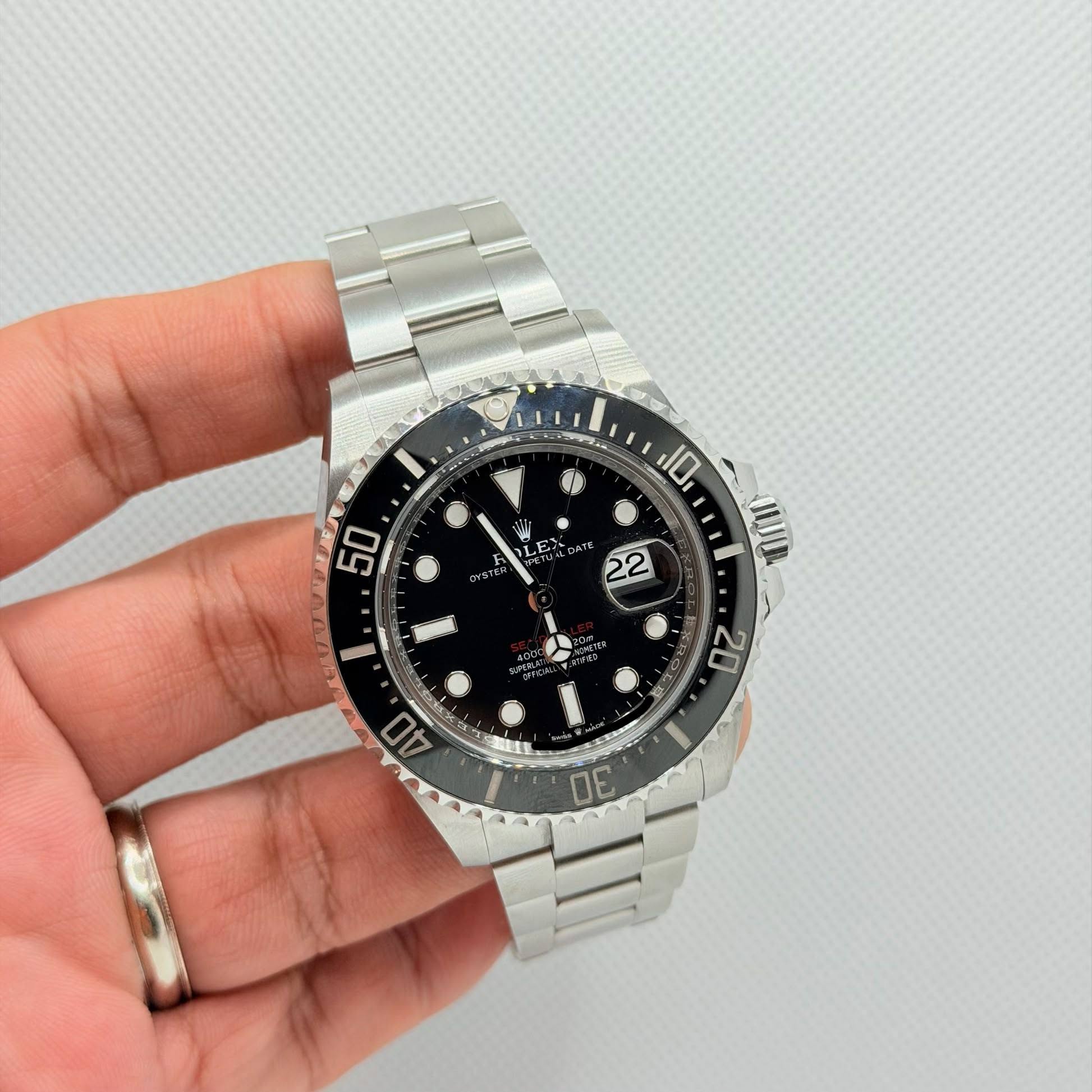 May be an image of wrist watch and text