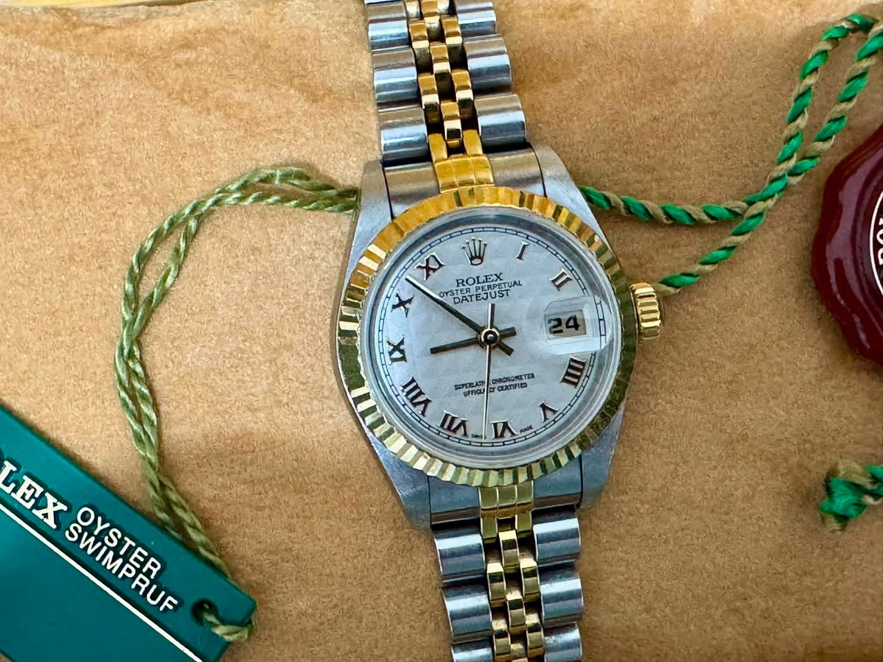 May be an image of wrist watch and text
