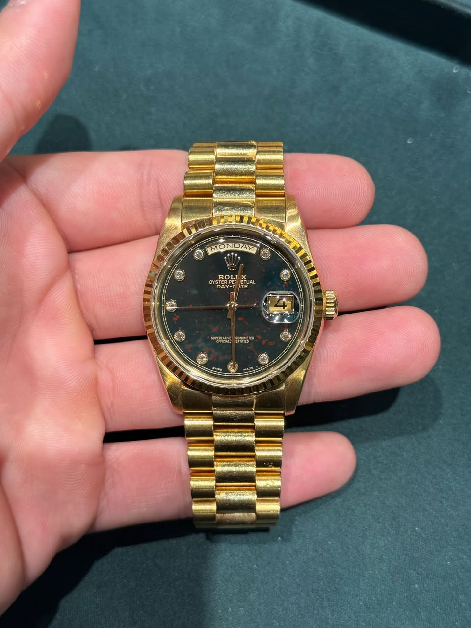 May be an image of wrist watch and text