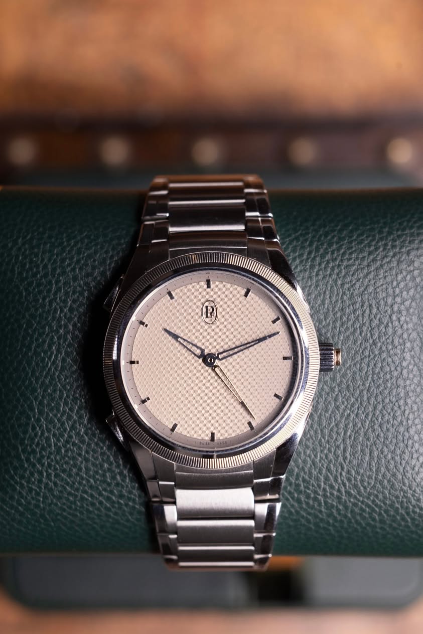 May be an image of wrist watch and text
